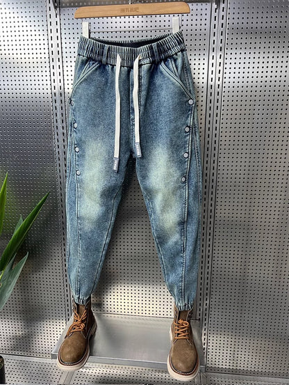 Mens Washed Denim Jeans With A Vintage Design, Featuring Button Detailing And A Tapered Leg